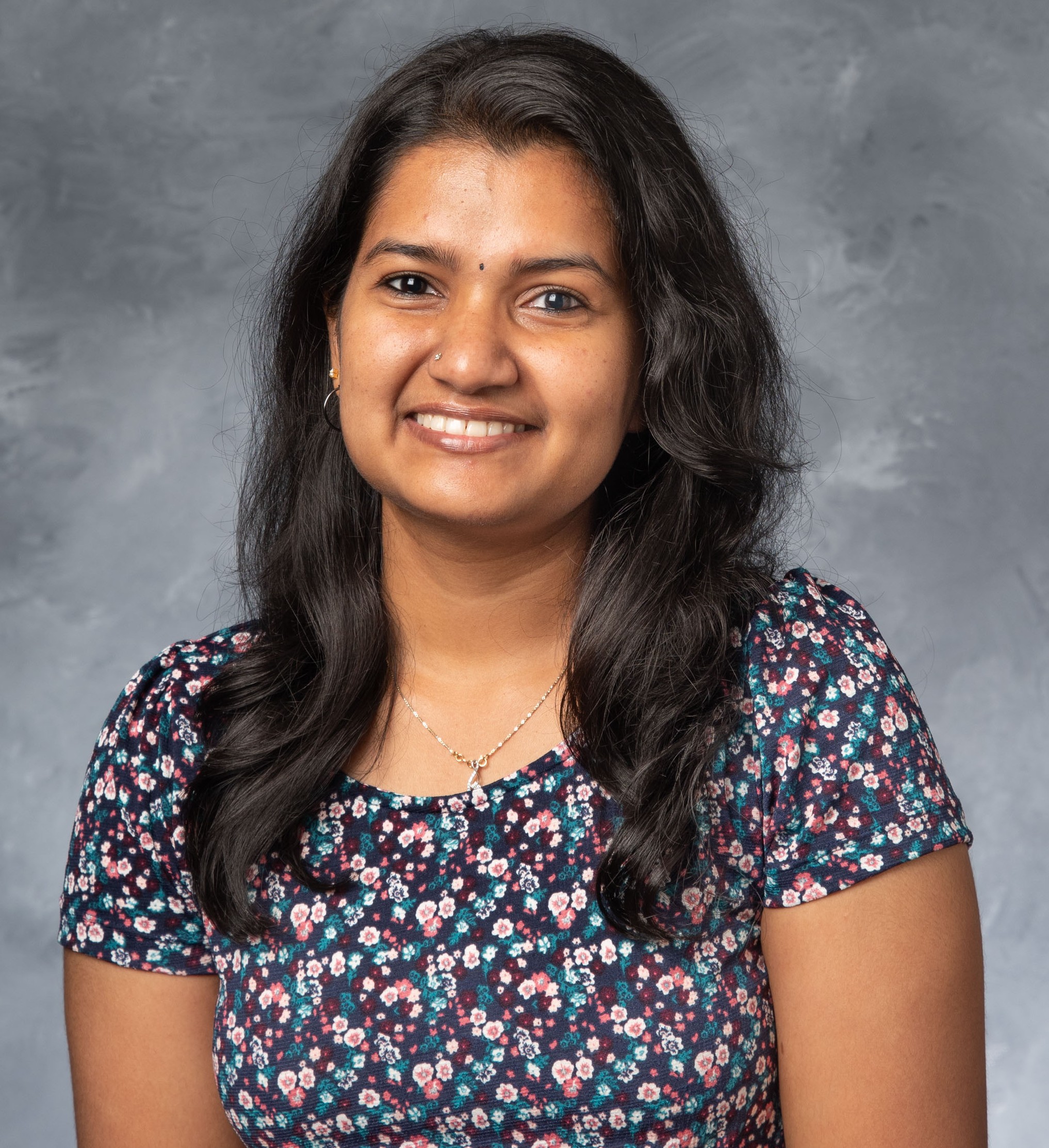 A professional portrait of Arathi Ashok